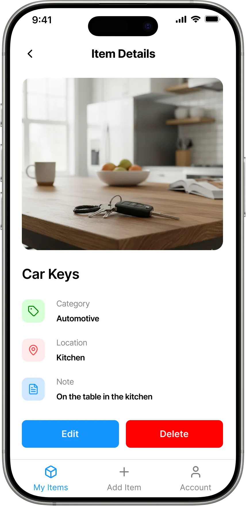 The iFoundIt item details screen showing car keys tagged as Automotive in the kitchen, with a note saying they are on the table in the kitchen